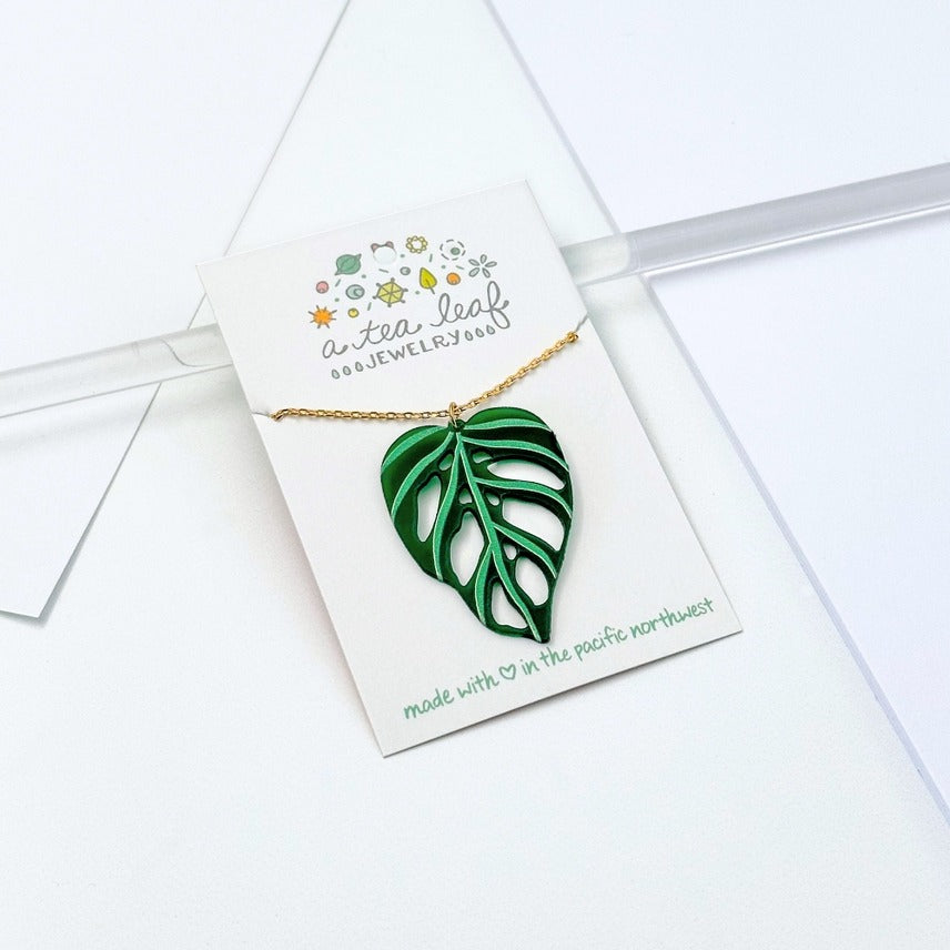 monstera necklace Monstera Adansonii Leaf Necklace Emerald Gold – Glass Growers Gallery & Gifts